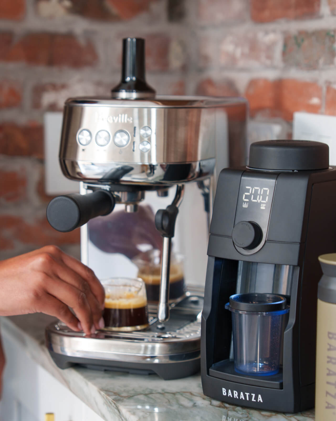 Baratza Encore ESP Pro | Coffee grinder on kitchen counter next to Breville espresso machine | Equator Coffees