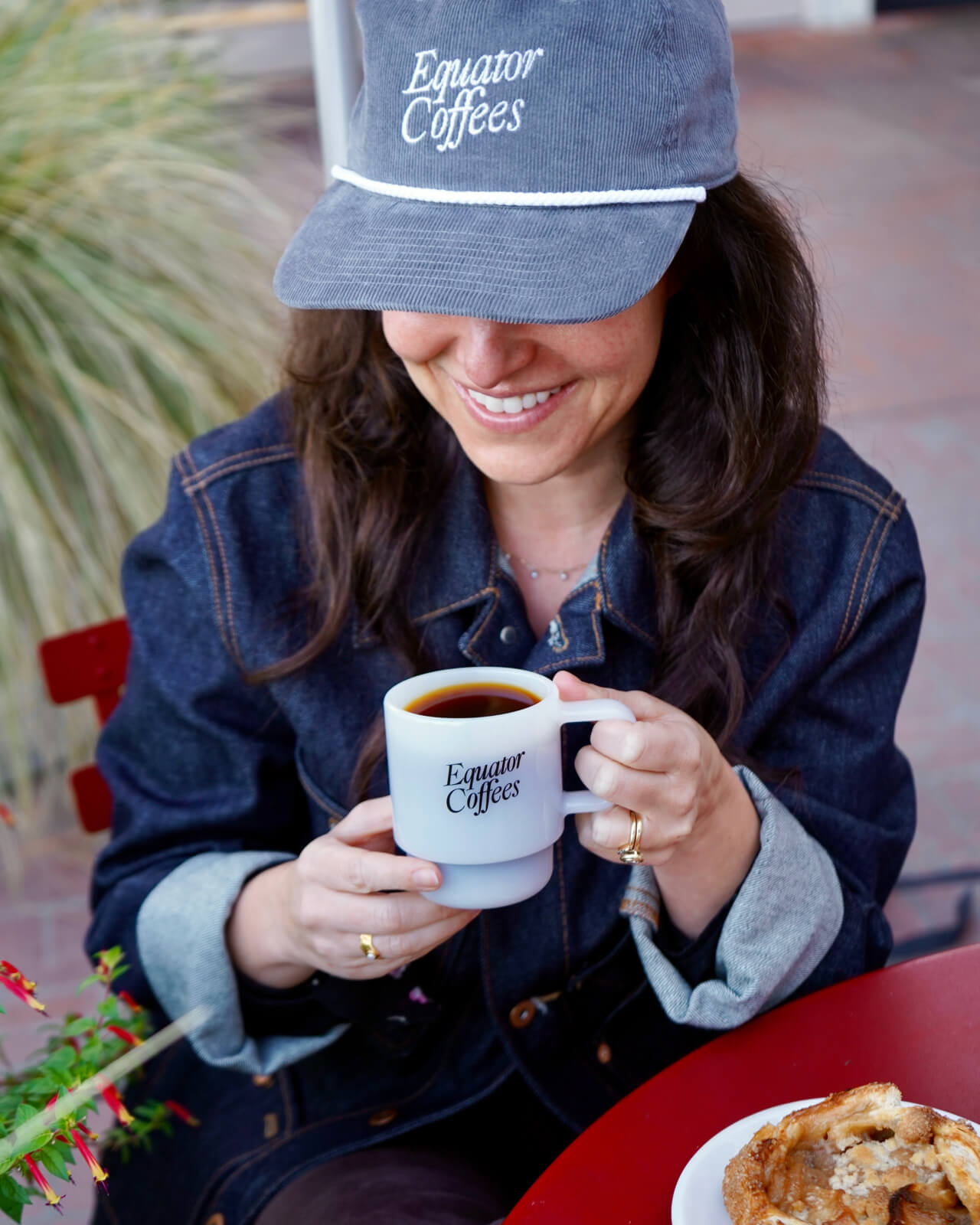 Enjoying freshly roasted coffee at a Marin cafe with the Equator Retro Milk Glass and Retro Corduroy Cap | Equator Coffees